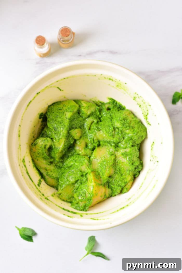Crispy Air-Fried Pesto Chicken 4 Crispy Air Fryer Pesto Chicken Thighs coated in green pesto and herbs.