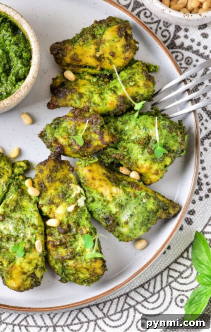 Crispy Air-Fried Pesto Chicken 8 Air Fryer Pesto Chicken plated and ready to be served, garnished with fresh basil.