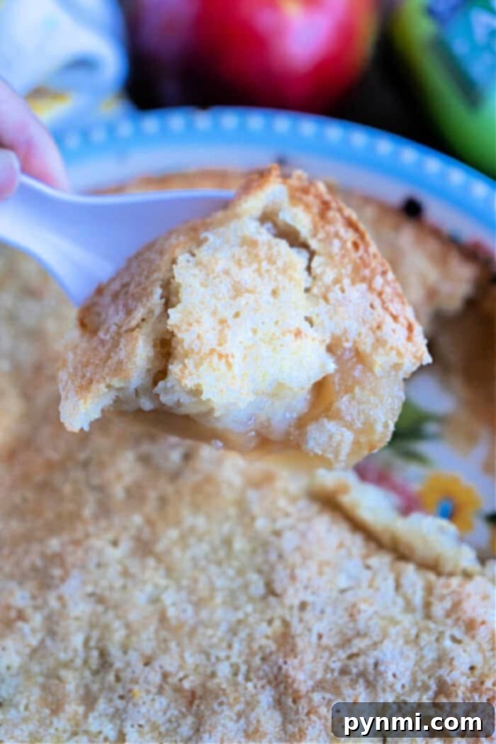 pour over pie crust - A spoonful of pour-over pie, showing the fluffy crust and fruit filling.