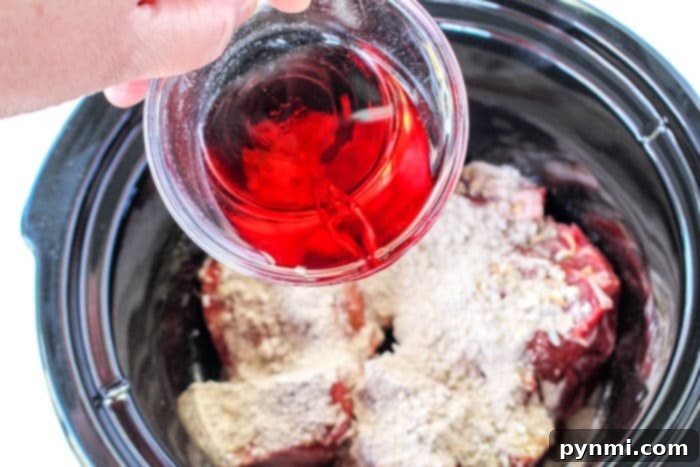 Beef Manhattan Recipe: close up of shredded beef with gravy.