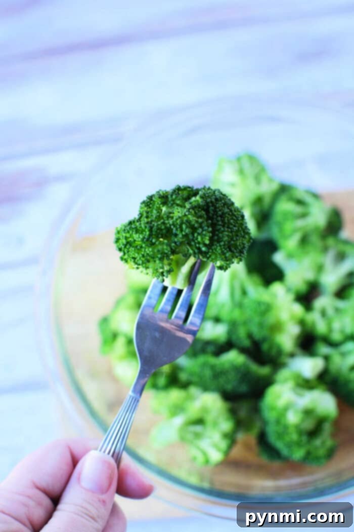Perfectly steamed broccoli, showcasing its vibrant green color and crisp texture.