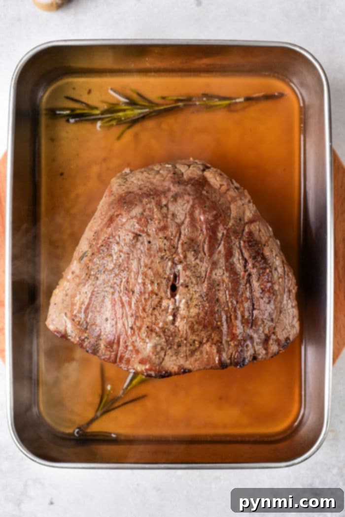 Close-up of freshly sliced, tender beef ready for making sliders.