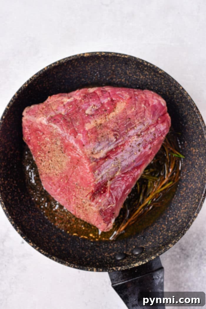 The Ultimate Melt-in-Your-Mouth Roast Beef 4 How to Cook Roast Beef in Oven - A perfectly seared and roasted piece of beef.
