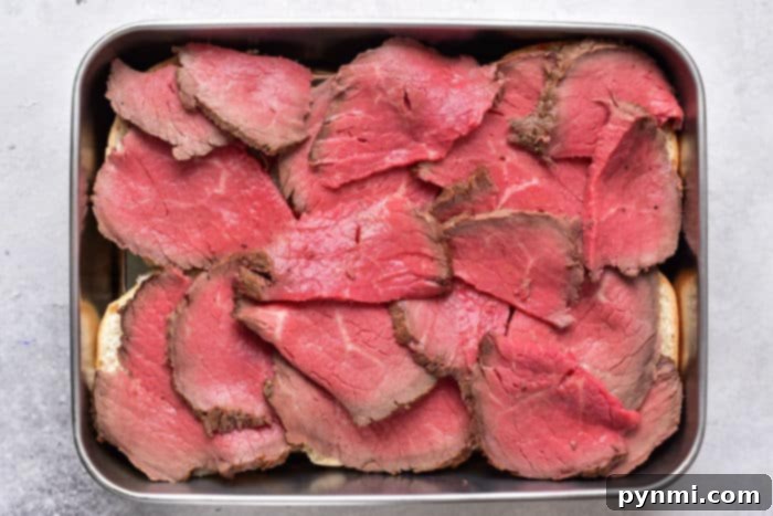 The Ultimate Melt-in-Your-Mouth Roast Beef 7 Baked Roast Beef - Beautifully sliced roast beef, ready to be served or stored.