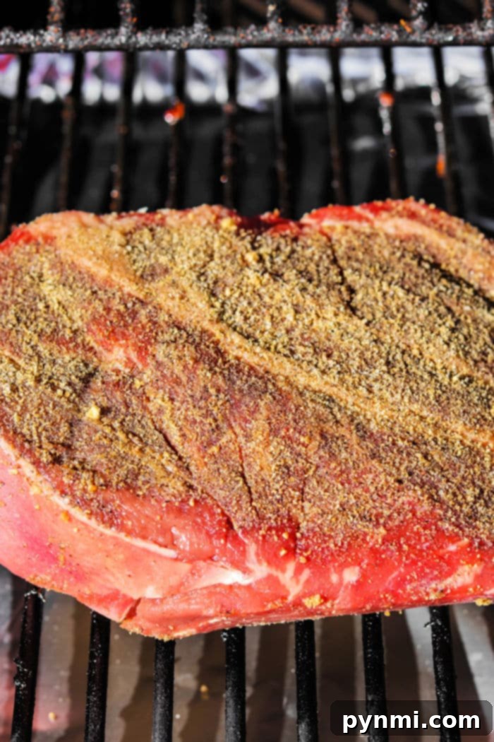 Texas Style Smoked Chuck 4 Smoked chuck roast cooking in an aluminum pan with sauce, covered with foil