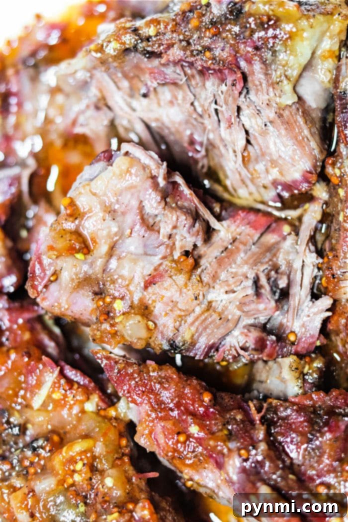 Texas Style Smoked Chuck 9 Large cut of Smoked Chuck Roast on a cutting board, ready to be prepared
