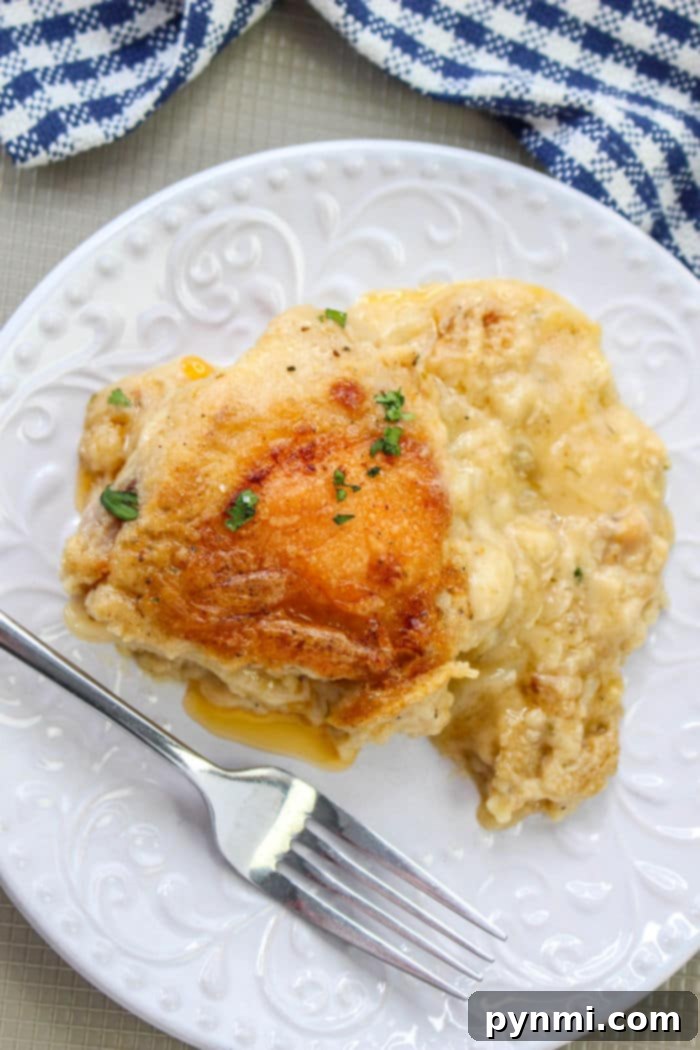 Creamy garlic butter chicken thighs cooked in a skillet with fresh parsley garnish, ready to be served. A rich and flavorful skillet chicken recipe.