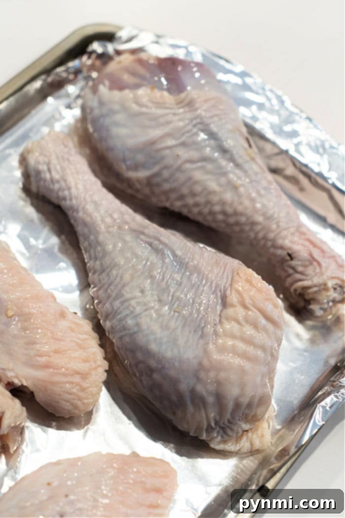 Golden Roasted Turkey Legs 4 Detailed Shot of Turkey Legs Being Prepared for Baking