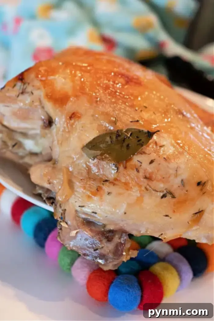 A beautifully roasted turkey breast with golden-brown, crispy skin, garnished with fresh herbs, resting on a wooden cutting board, ready to be carved. The image evokes a sense of accomplishment and deliciousness.