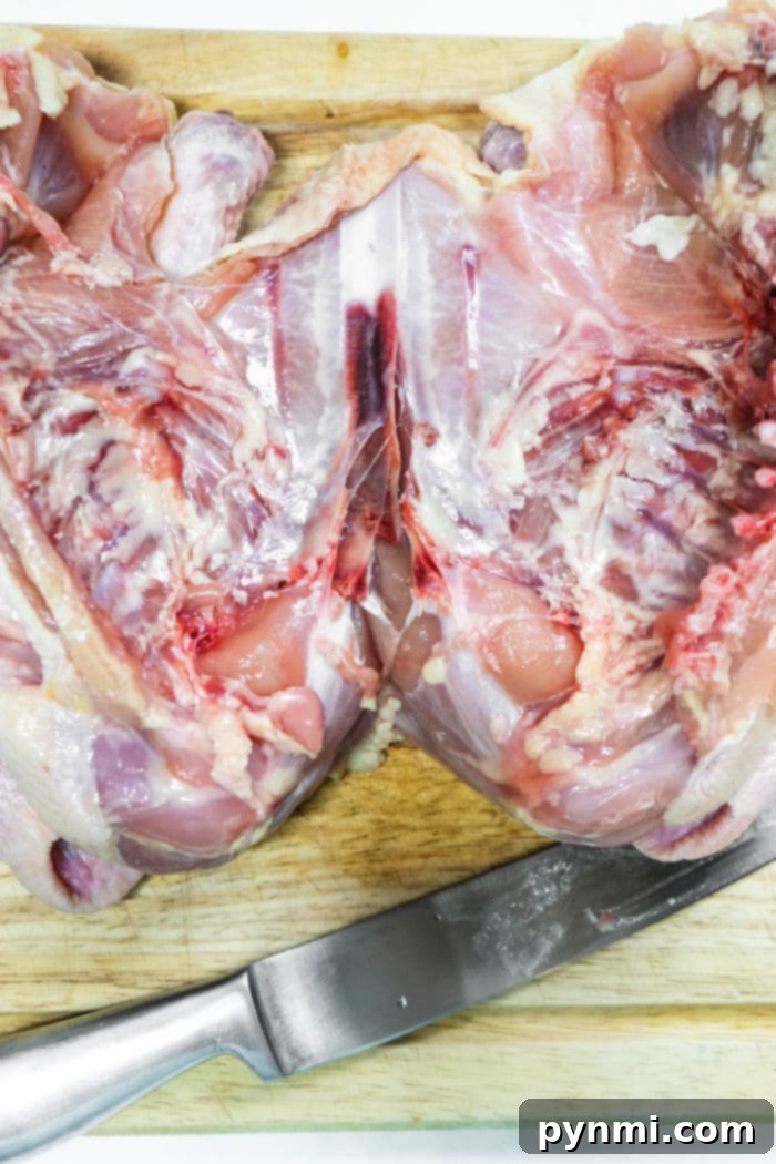 Succulent Bone-In Chicken Breast Recipes 7 how to cook split chicken breasts - raw chicken breasts on a cutting board
