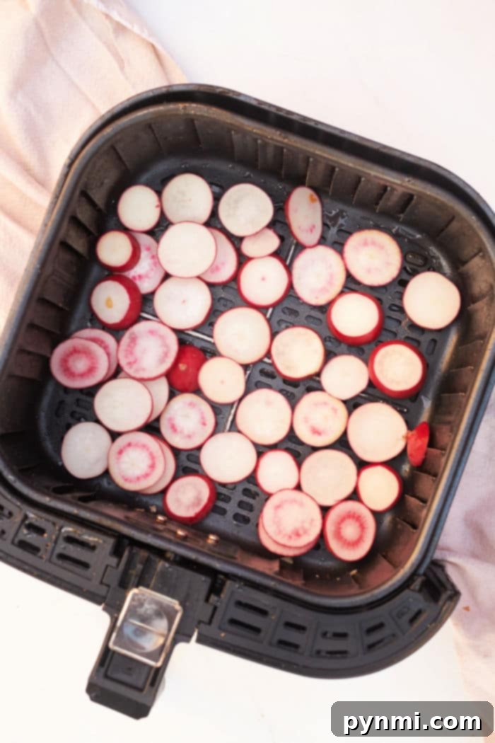 Air Fryer Radishes - Sliced radishes ready for air frying