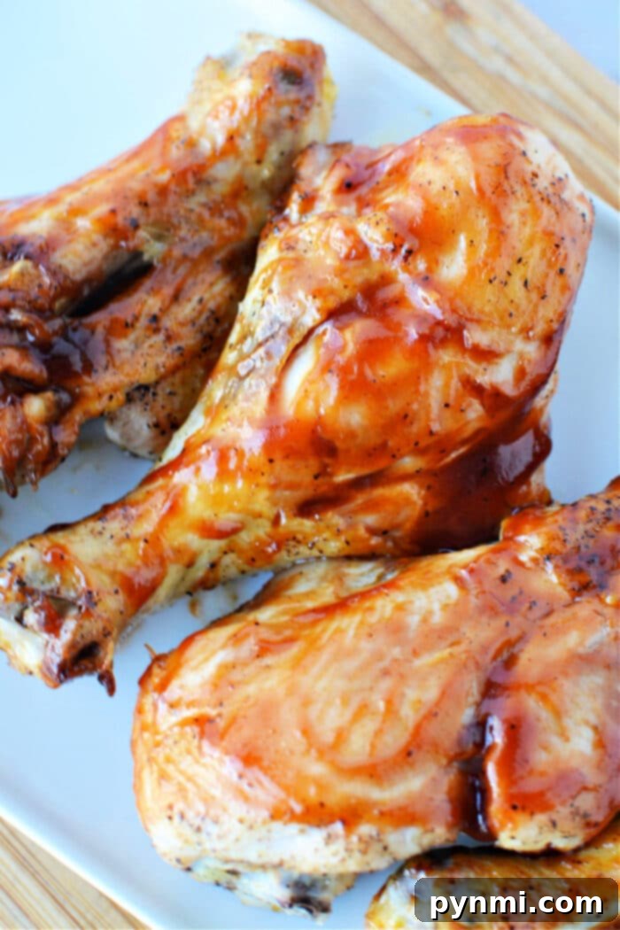Butterflied Chicken Legs on a pristine white cutting board, meticulously prepared and ready for seasoning and cooking.