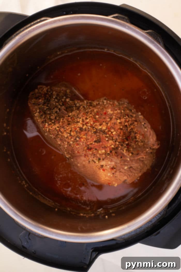 Quick & Tender Instant Pot Sirloin Tip Roast 6 Slices of Instant Pot Sirloin Tip Roast served with gravy