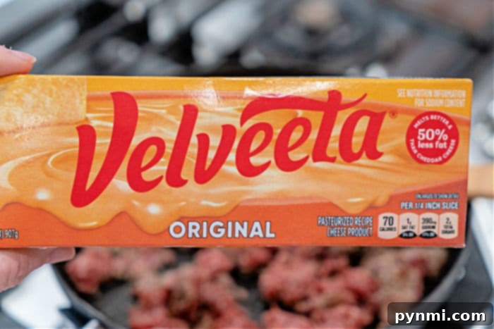 Creamy Velveeta Sausage Rotel Dip 3 Close-up of creamy Velveeta Rotel sausage dip in a slow cooker, ready to serve.