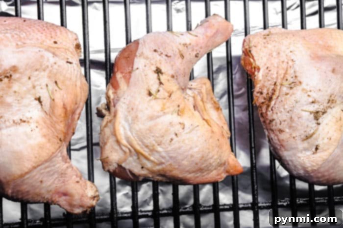 Smoker's Secret Chicken Brine 5 Perfectly brined and smoked chicken drumsticks resting on a cutting board, ready to be served.
