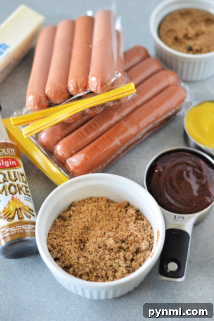 The countertop is a culinary stage set with essential ingredients: hot dogs, brown sugar, liquid smoke, mustard, and barbecue sauce, all ready to create mouthwatering hot dog burnt ends.