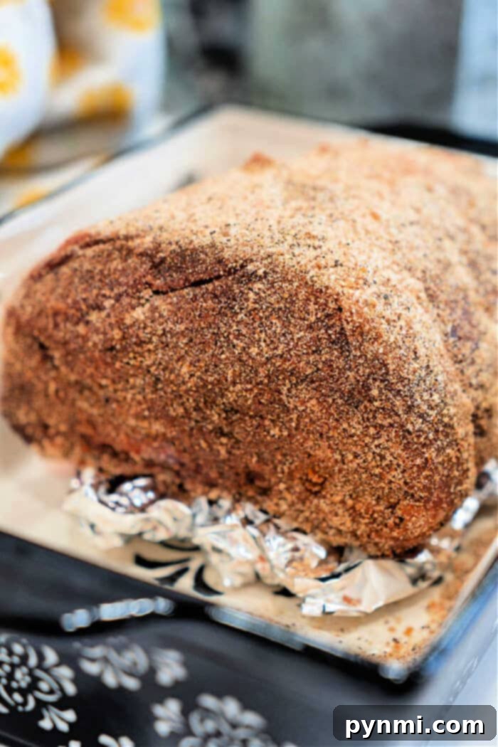 Top round roast with dry rub, served with roasted vegetables