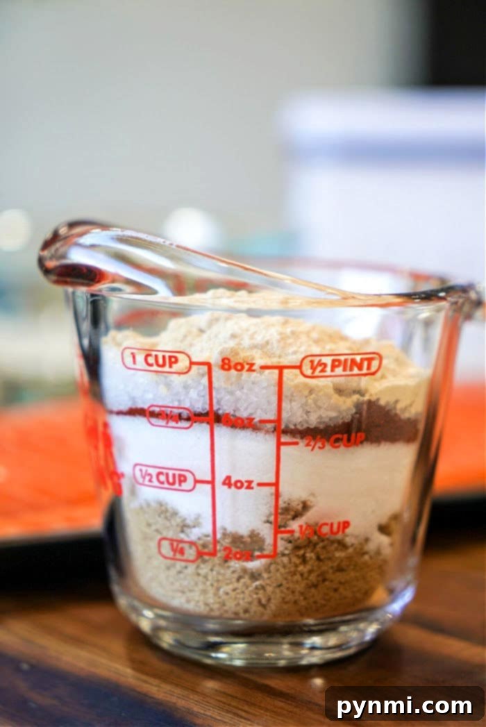 Step-by-step instructions for applying a dry rub to frozen chicken.