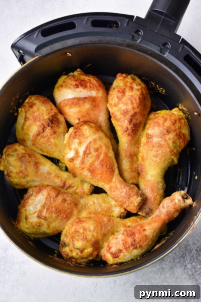 Crispy Air Fryer Curry Chicken 5 Finished air fryer curry chicken drumsticks in the basket