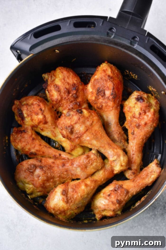 Crispy Air Fryer Curry Chicken 6 Plated curry fried chicken drumsticks with fresh cilantro garnish