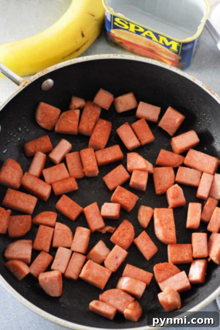Fried Spam ready to be served, showing golden crispy pieces