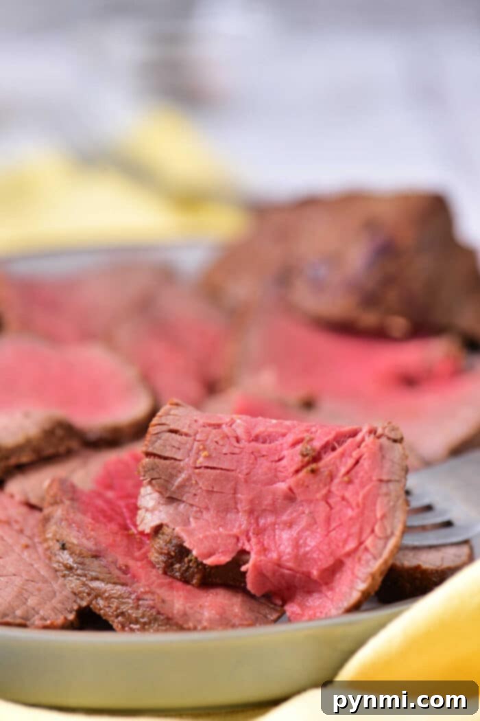 London Broil sliced against the grain, showcasing its tender texture after oven cooking at 350F