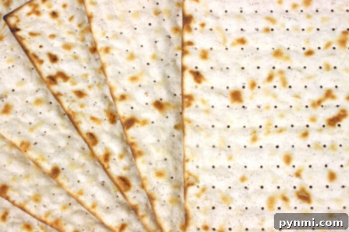 The Matzo Ball Demystified: History, How-To, and a Classic Recipe 3 Close-up of traditional matzah crackers, the base ingredient for matzo meal.
