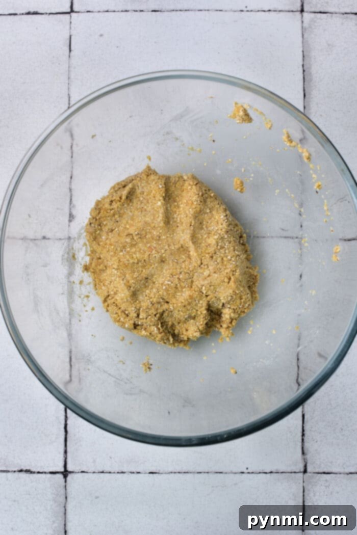 The Matzo Ball Demystified: History, How-To, and a Classic Recipe 5 A close-up view of matzo meal in a bowl, showcasing its texture as the primary ingredient for matzo balls.