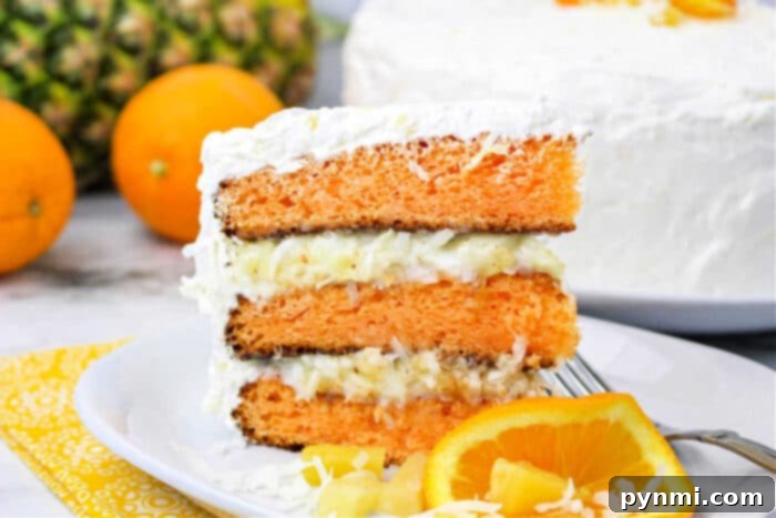 Aloha Bliss Cake 7 Hawaiian Cake with Pineapple and Coconut: A close-up of the delicious filling and cake layers.