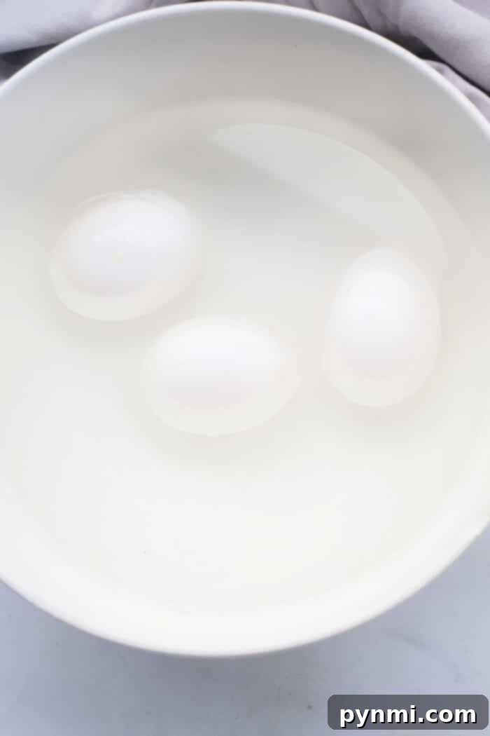 Perfect Soft Boiled Eggs Timing Guide 4 How to Cook Soft Boiled Eggs for Ramen - Sliced soft-boiled eggs with jammy yolks, perfect for adding to ramen.