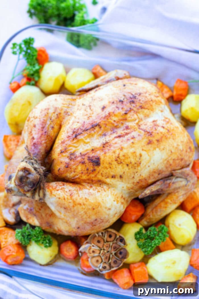 Ultimate Juiciness: Whole Chicken Brine 5 A beautifully roasted whole chicken, brined for tenderness, served with roasted potatoes, carrots, and garlic.