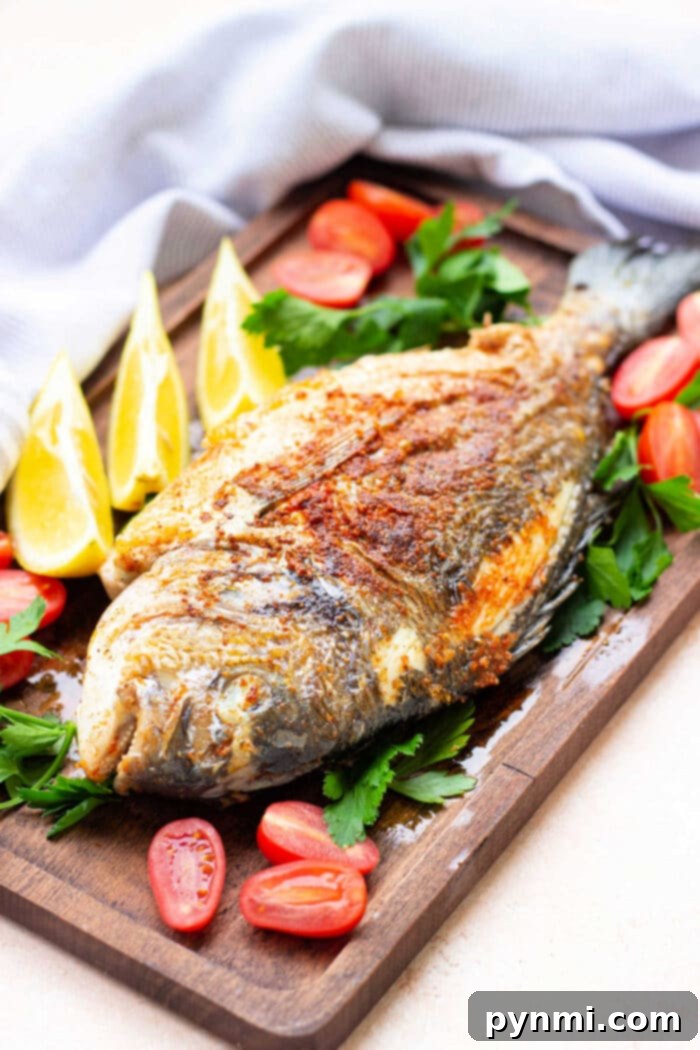 A final shot of a perfectly fried whole fish, ready to be enjoyed as a delicious meal.
