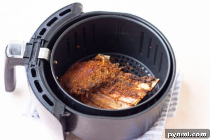 Crafting Irresistible Lamb Ribs 5 Slow Cooker Lamb Ribs in a multi-cooker, showcasing their tender, succulent texture ready to be enjoyed.