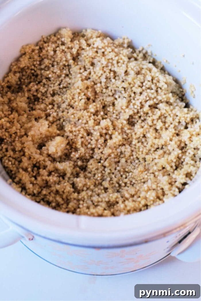 Unlock Fluffy Quinoa: The Secret to Perfect Grain 3 How to Cook Quinoa in Slow Cooker - Fluffy, cooked quinoa resting in a slow cooker, ready for serving.