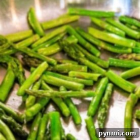 Crispy Skillet Asparagus 6 Pan-fried asparagus is sizzling to perfection in a stainless steel pan.