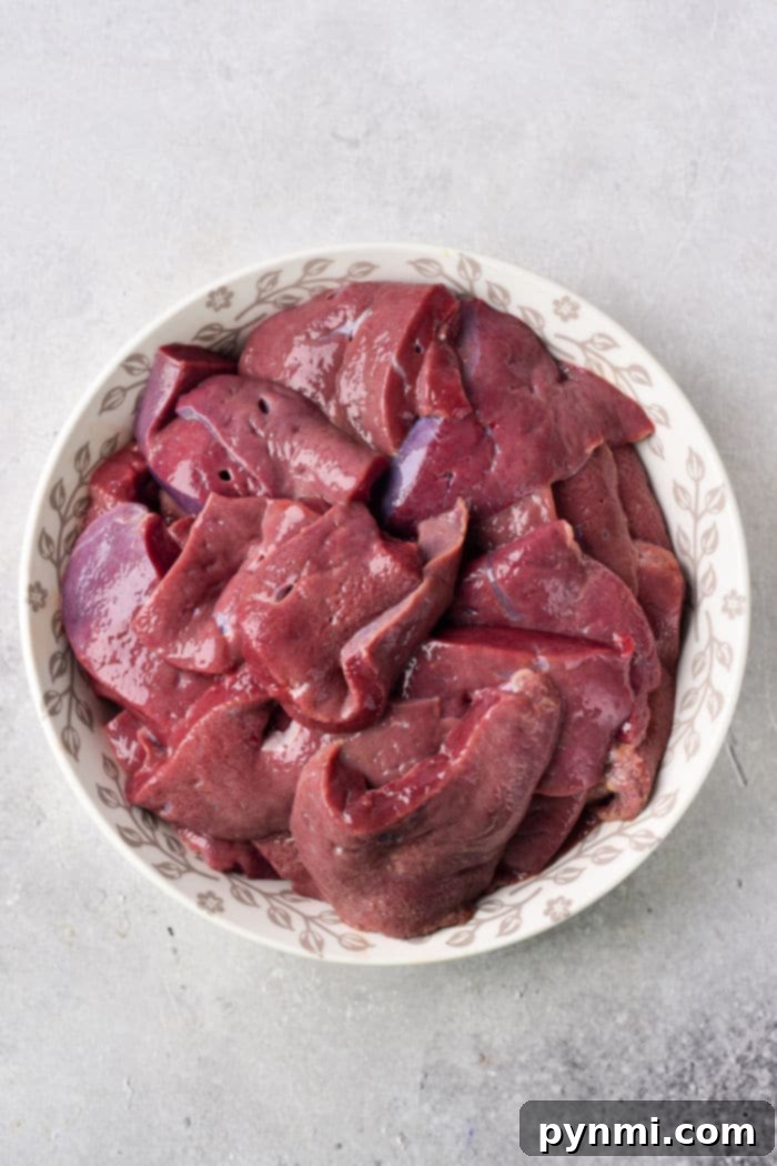The Art of Offal Unlocking Organ Meat Flavors 3 Deliciously sautéed liver served with a generous portion of golden caramelized onions, a prime example of well-prepared organ meat