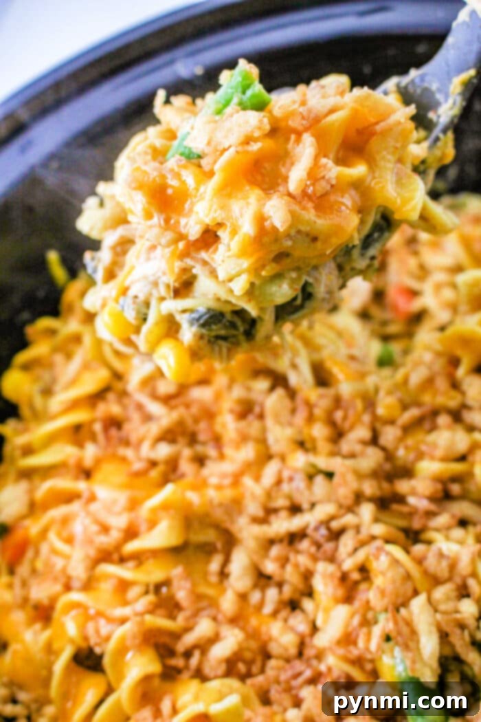 Creamy Slow Cooker Chicken Noodle Delight 6 Overhead view of a delicious Crockpot Chicken Noodle Casserole in a serving dish