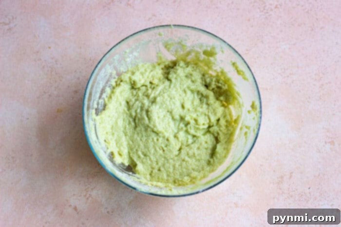 Green Goddess Avocado Cake 4 A vibrant green avocado cake, showcasing its unique and delicious appeal, ready to be enjoyed.