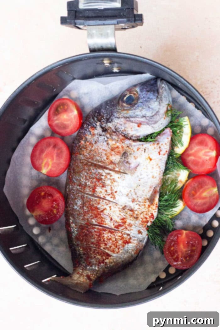 How long to cook whole fish in air fryer - a close-up of a perfectly cooked, golden-brown whole fish