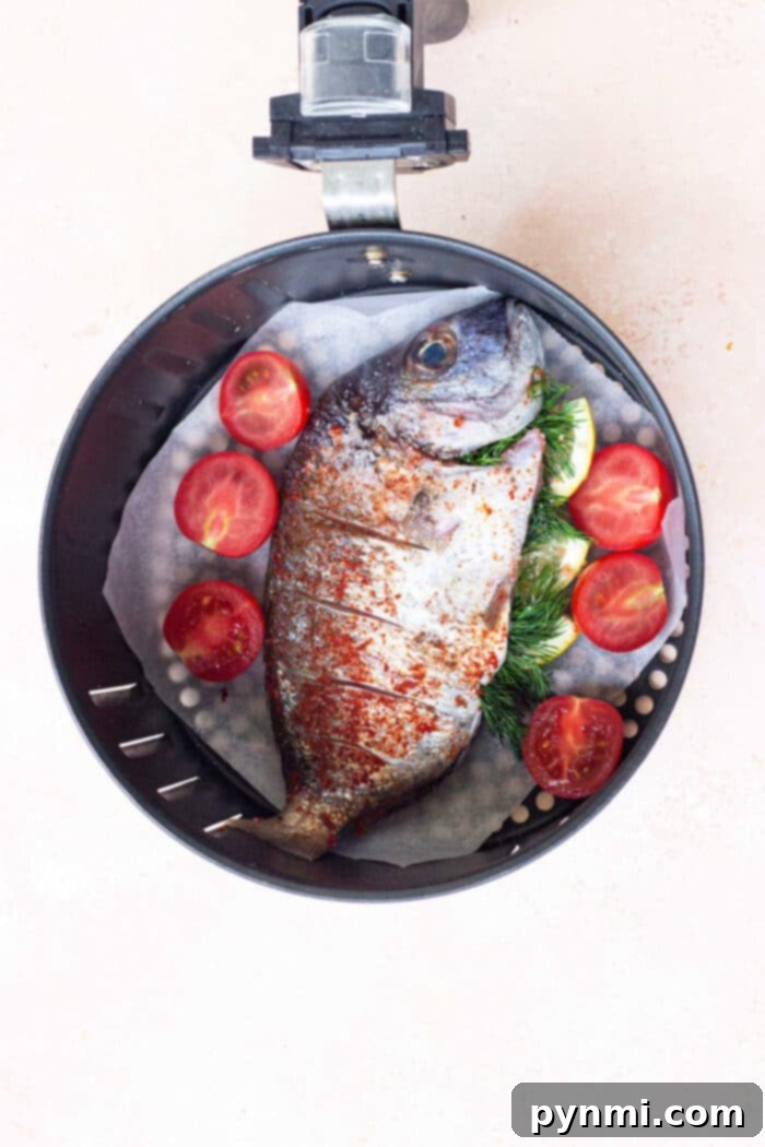 Whole Fish in Air Fryer No Breading - a beautifully plated whole fish with lemon and herbs