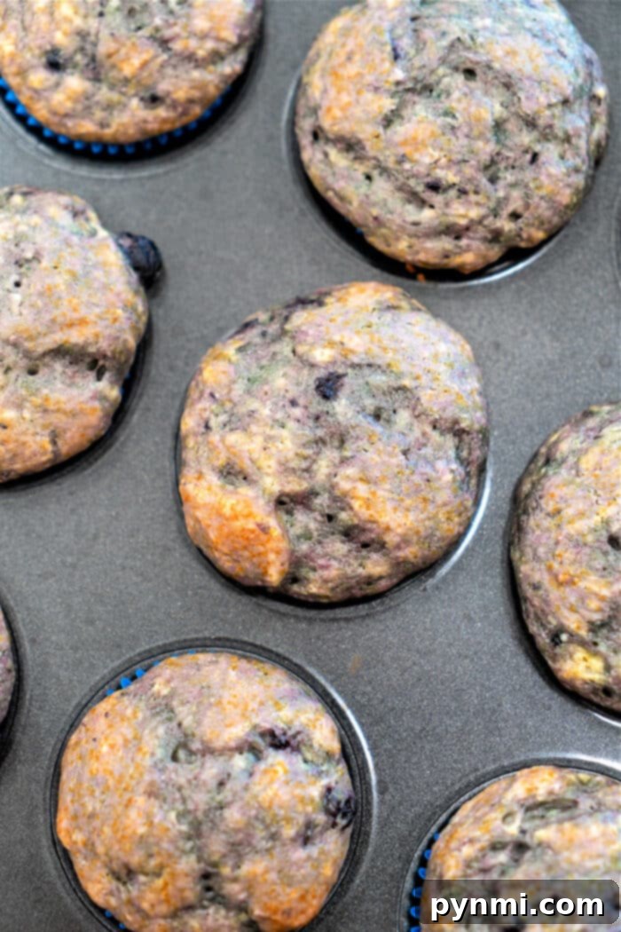 Freshly baked Pie Filling Muffins cooling on a rack