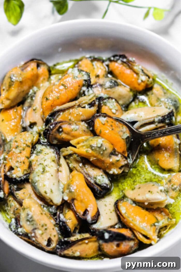 Smoked Mussels Recipe, garnished with fresh herbs, showcasing a delicious way to enjoy frozen mussels.