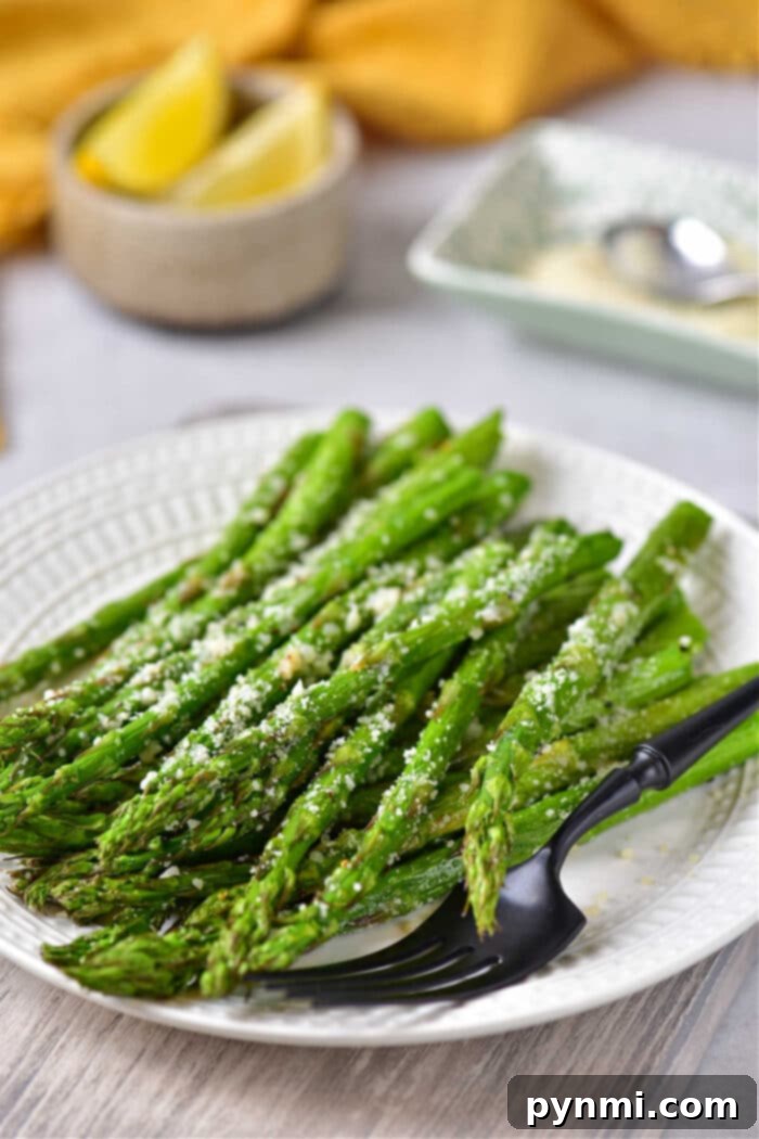 Frozen asparagus being prepared in a Ninja Foodi air fryer