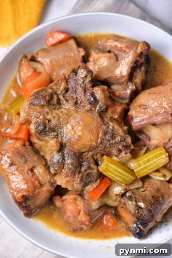 Delicious Braised Oxtail Recipe in a Dutch Oven with vegetables
