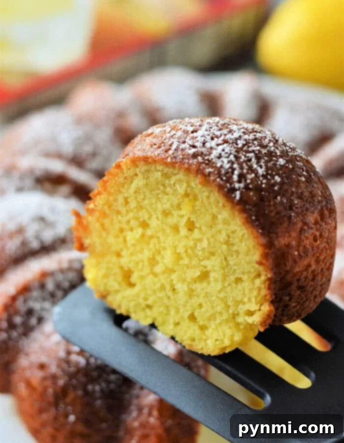 betty crocker Lemon Bundt Cake - Another angle of a glazed lemon bundt cake, highlighting its golden-brown crust.