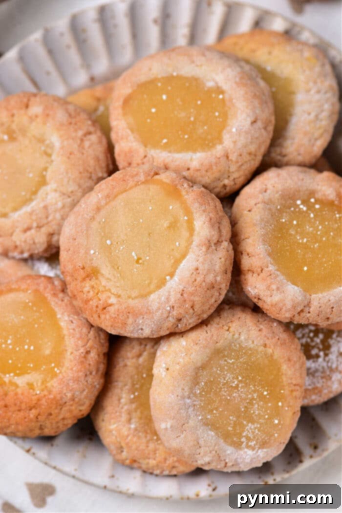 Lemon Curd Cookies, golden-baked with a generous dollop of yellow lemon curd in the center.