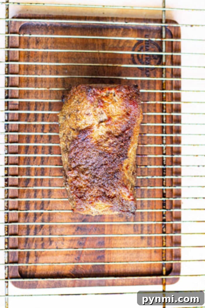 Achieving the Perfect New York Strip Roast 5 Sliced New York Strip Roast, showing medium rare doneness