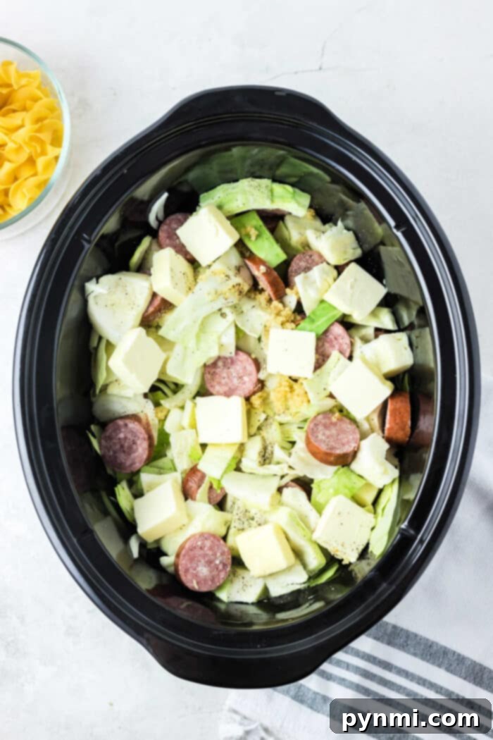 Effortless Slow Cooker Haluski 5 Hearty slow cooker cabbage and noodles with savory kielbasa, a perfect comforting meal for any occasion.