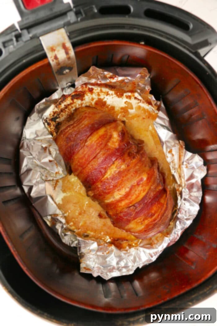A delicious Air Fryer Meatloaf Recipe, sliced and served, showcasing a perfect texture and golden-brown crust.
