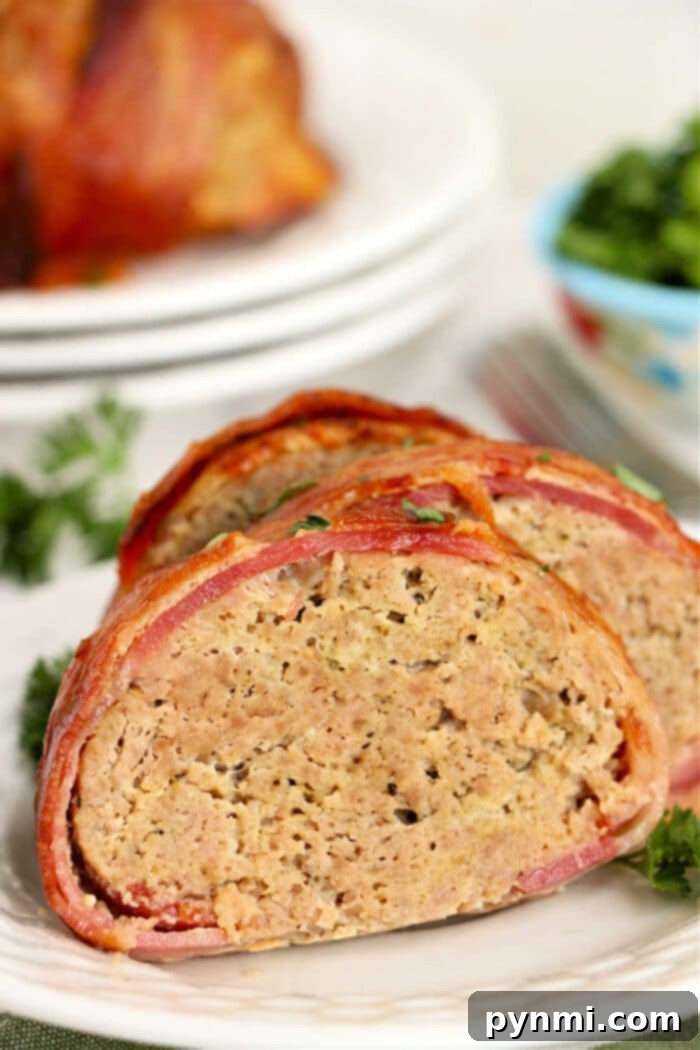 Bacon Wrapped Meatloaf, freshly cooked and glistening, ready for serving.